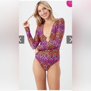NWT Trina Turk Echo ring front one piece paddle suit. Sz small.